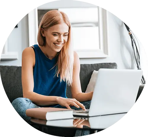 Smiling Woman sitting at a computer