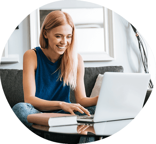 Smiling Woman sitting at a computer